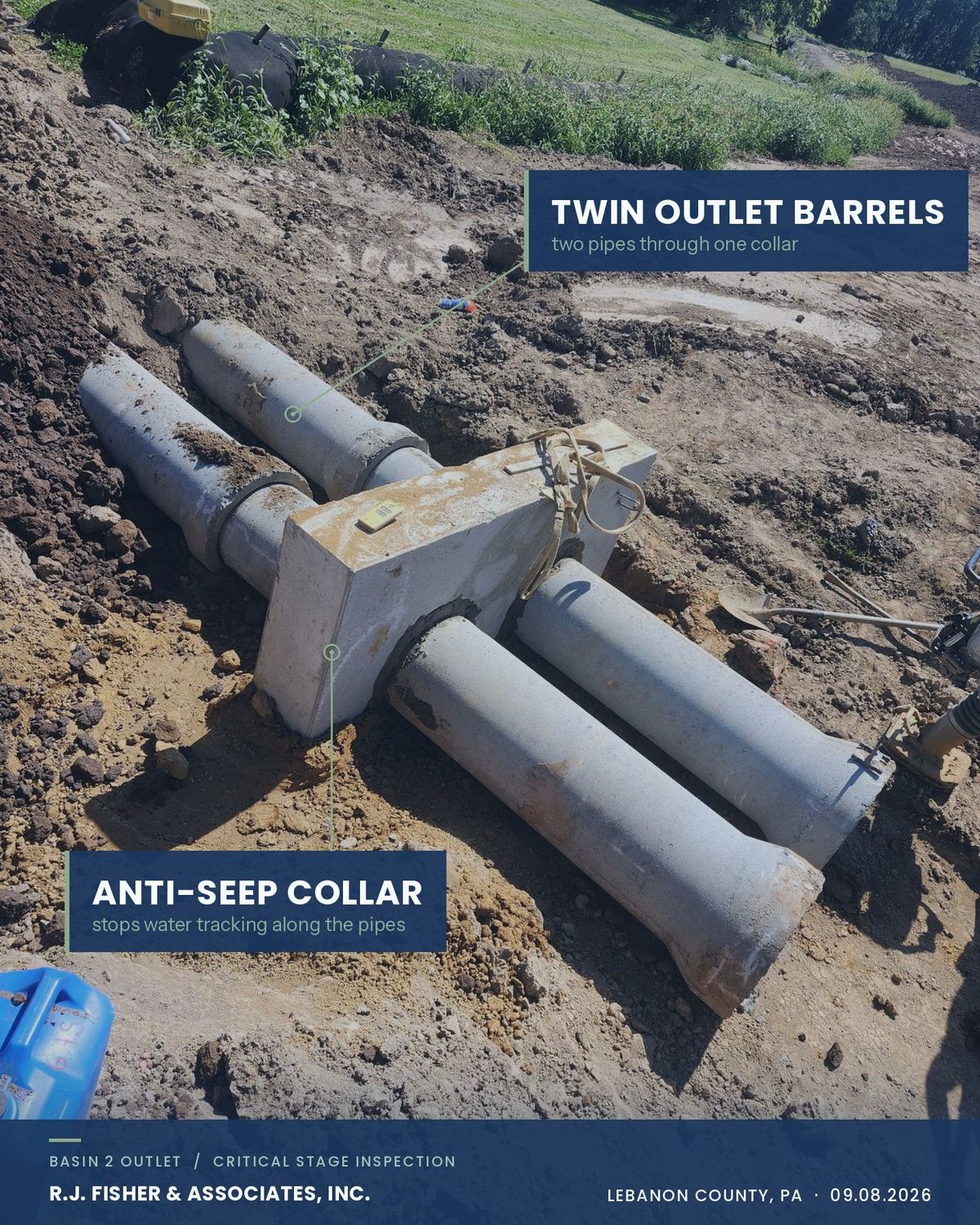 Two concrete outlet barrels passing through a single anti-seep collar in an open trench at a stormwater basin outlet